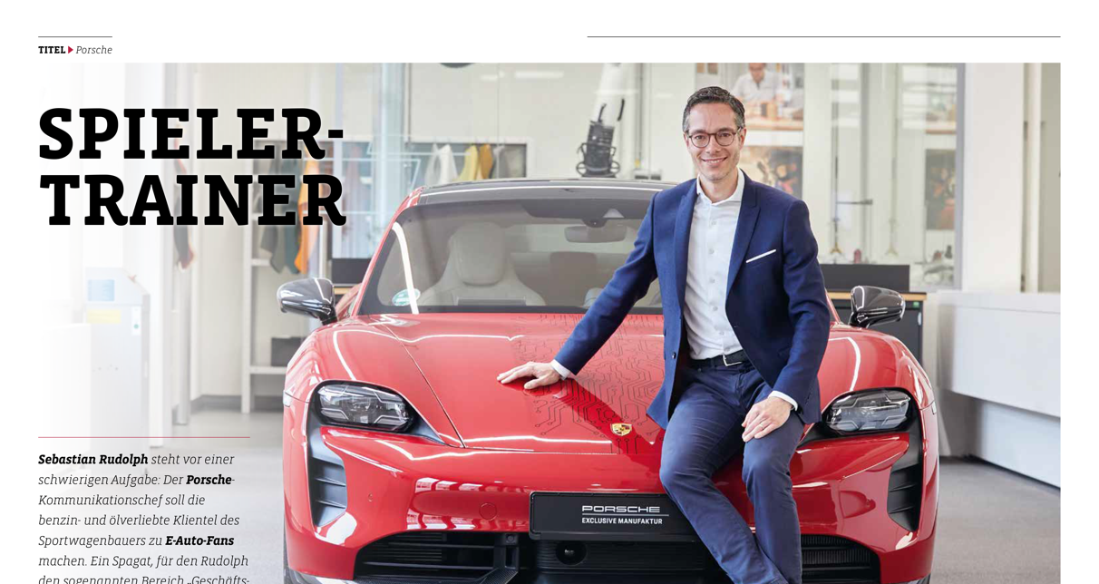 Porsche Kommunikations-Chef Sebastian Rudolph auf einem Porsche sitzend